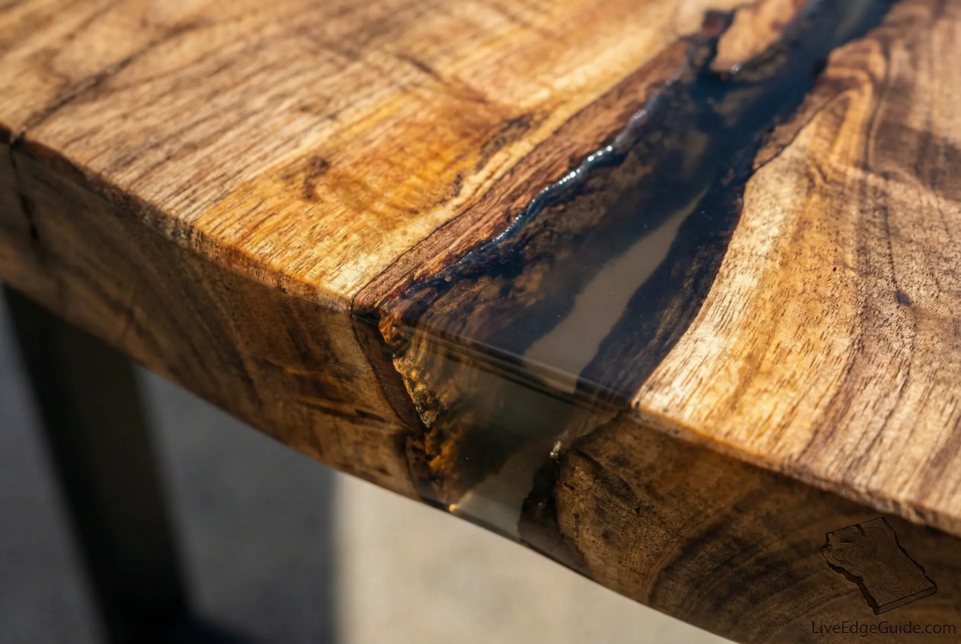 Epoxy resin being used to fill cracks and voids in live edge wood